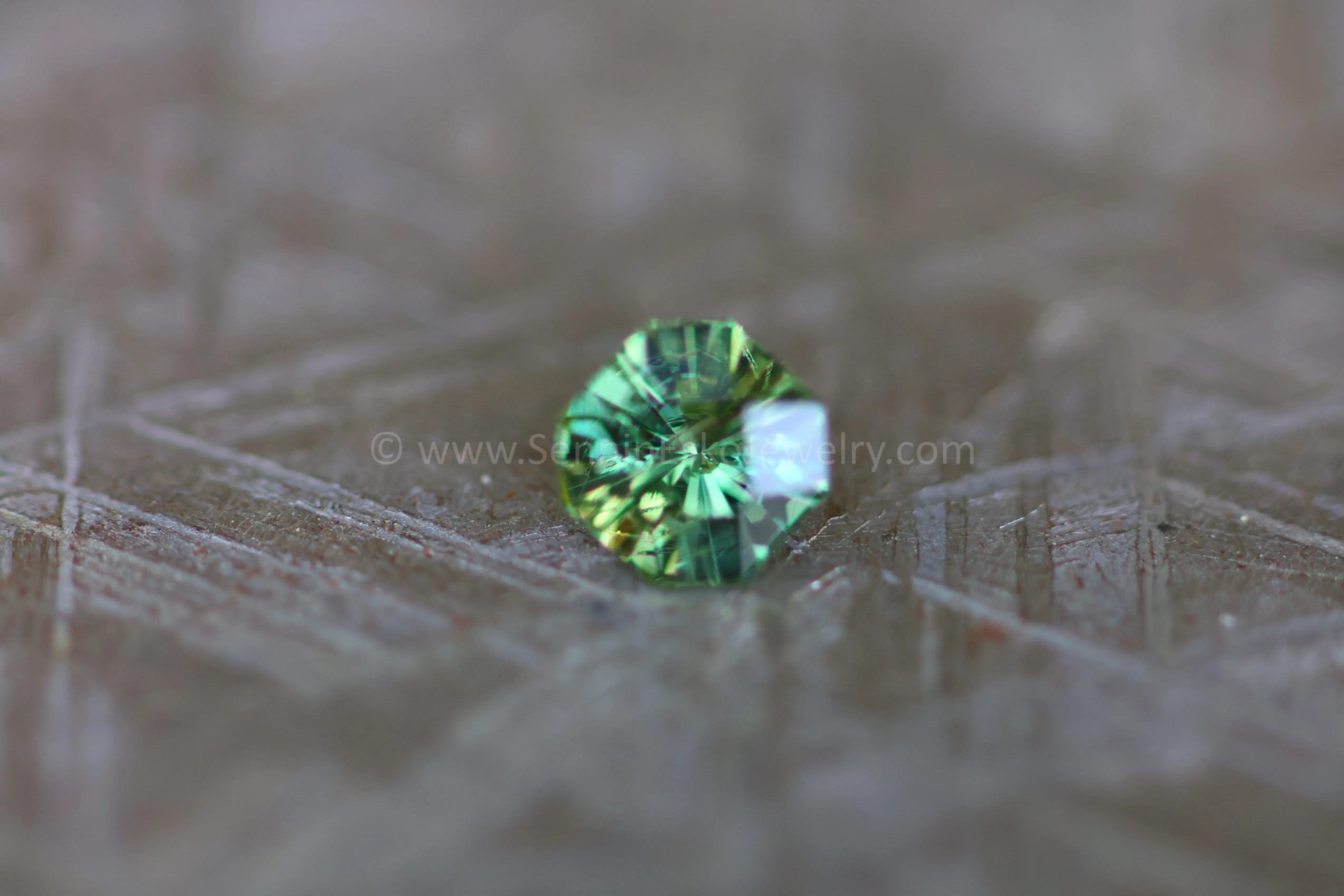 (Less Than Perfect) 0.58 carat Yellowish Green Sapphire Octagon -  Precision Cut, 4.8x5.1mm